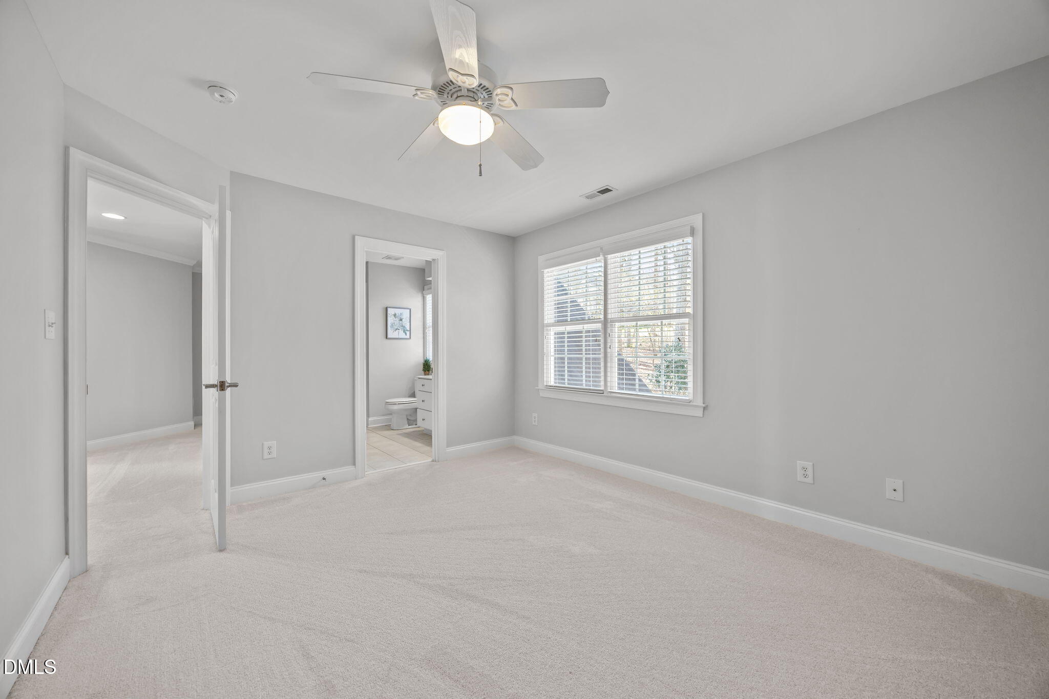 111 Lake Ridge Place Chapel Hill, NC 27516 - Photo 63 of 84 en empty room with windows and ceiling fan