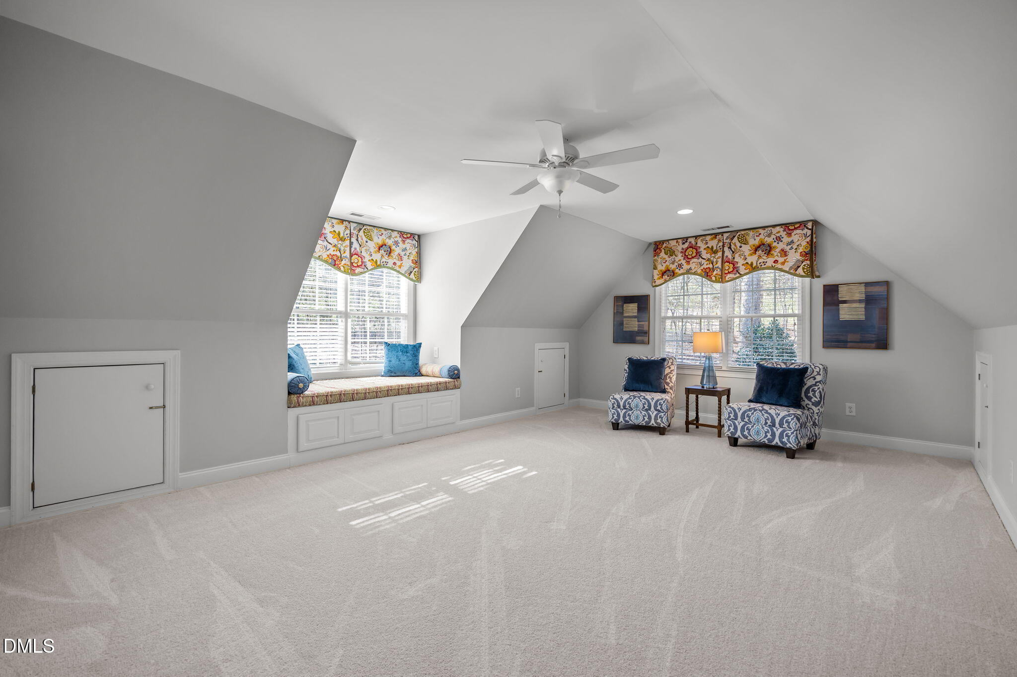 111 Lake Ridge Place Chapel Hill, NC 27516 - Photo 64 of 84 a view of a livingroom with a flat screen tv a ceiling fan and a window
