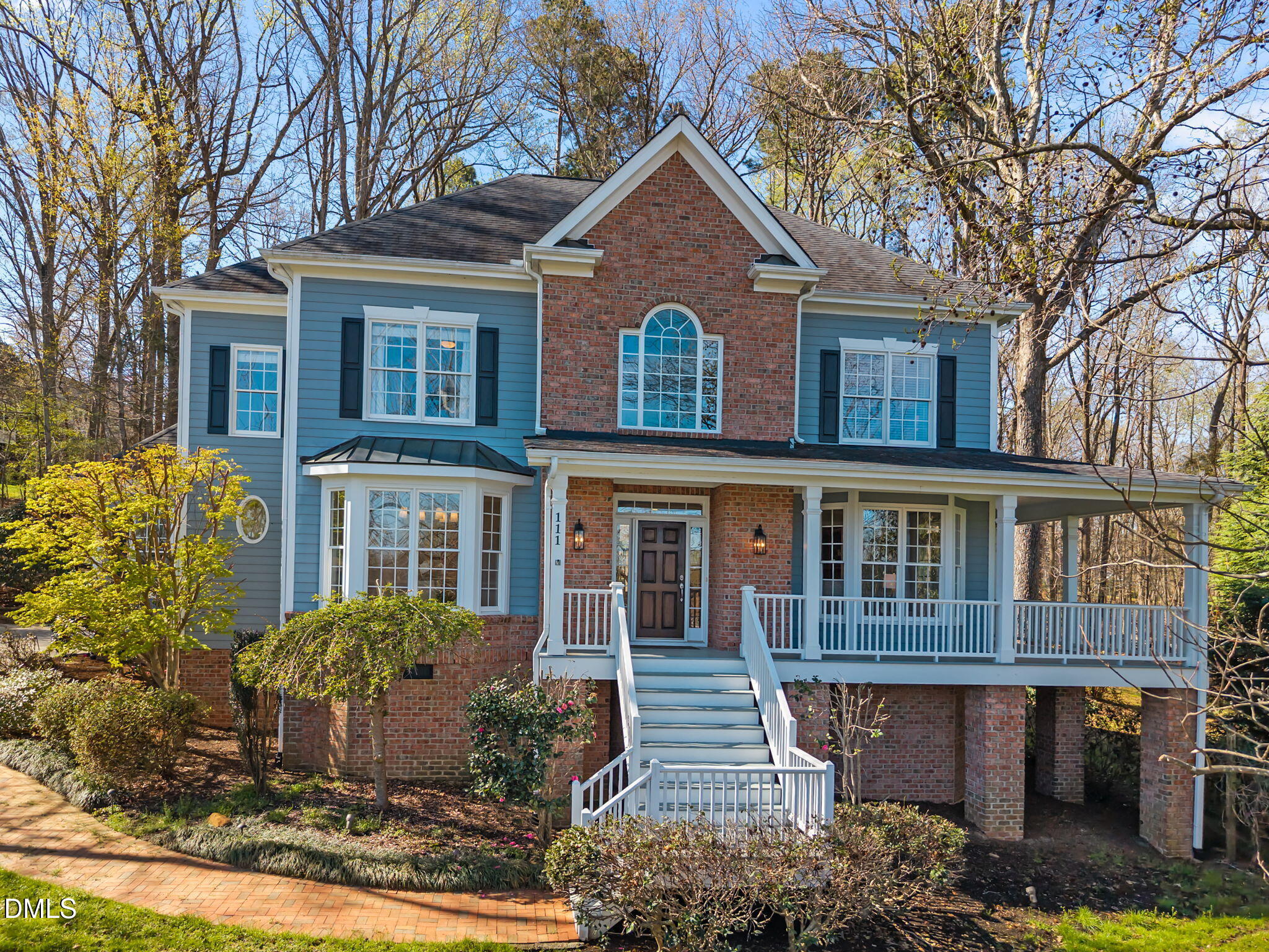 111 Lake Ridge Place Chapel Hill, NC 27516 - Photo 77 of 84 a front view of a house with garden