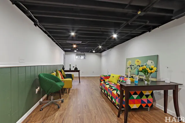 a view of a dining room with furniture and toys