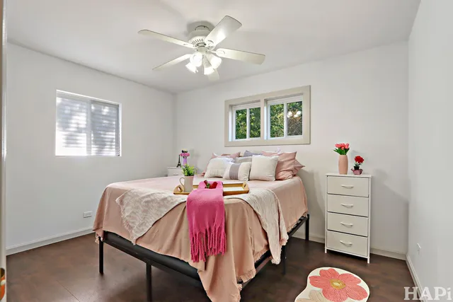 a bed room with a bed and a chandelier