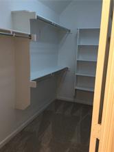 14812 Avery Ranch Boulevard, Unit 64 Austin, TX 78717 - Photo 17 of 26 a view of walk in closet with empty racks
