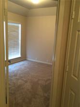 14812 Avery Ranch Boulevard, Unit 64 Austin, TX 78717 - Photo 22 of 26 a view of an empty room with wooden floor and a window