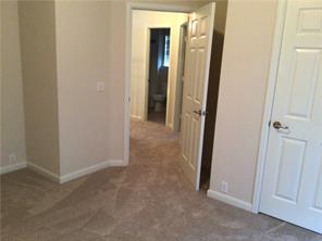 14812 Avery Ranch Boulevard, Unit 64 Austin, TX 78717 - Photo 24 of 26 an empty room with mirror