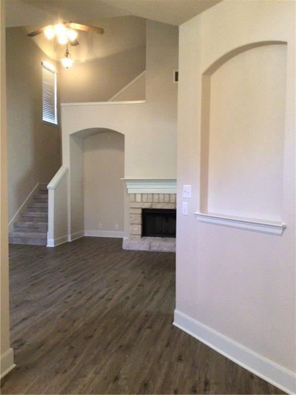 14812 Avery Ranch Boulevard, Unit 64 Austin, TX 78717 - Photo 5 of 26 a view of a livingroom with wooden floor and a fireplace