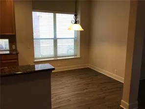 a bathroom with a granite countertop sink and window