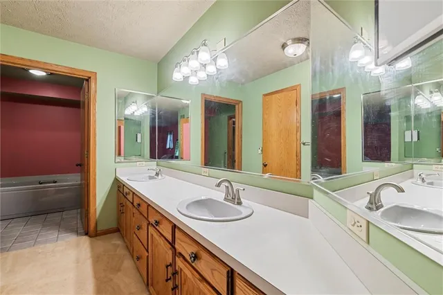 a bathroom with a bathtub and shower