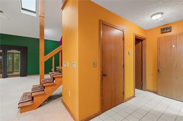 a view of a hallway with seating area