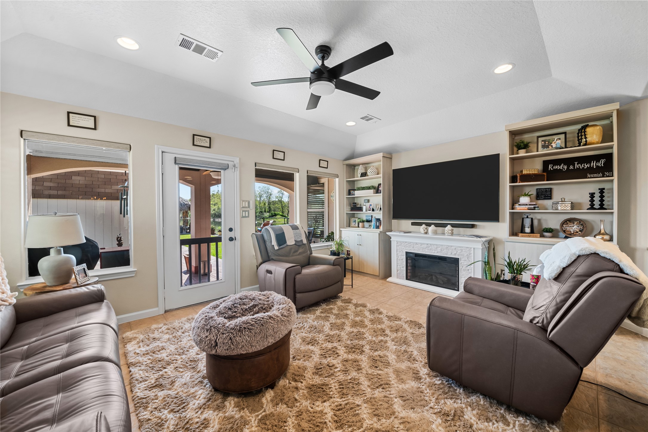 615 28th Street Dickinson, TX 77539 - Photo 14 of 34 a living room with furniture and a flat screen tv