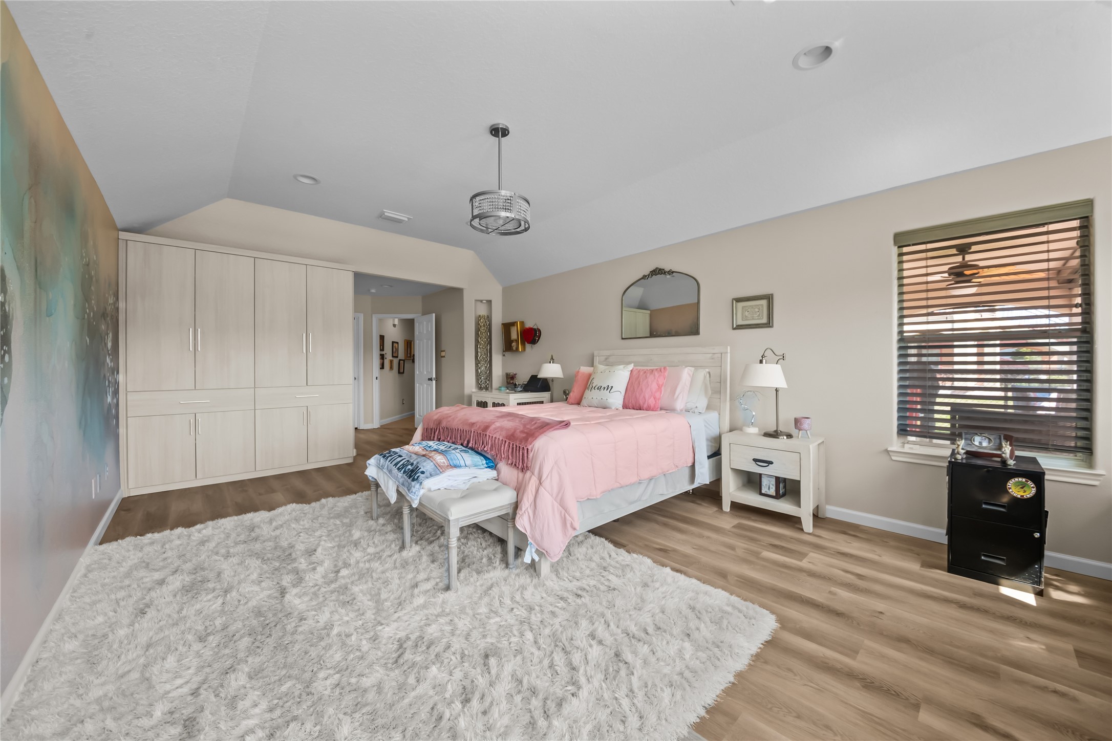 615 28th Street Dickinson, TX 77539 - Photo 16 of 34 a bedroom with a bed and wooden floor