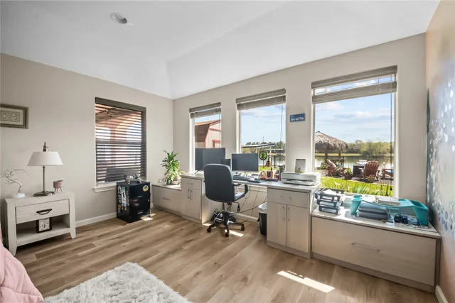 a room with a large window and gym equipment