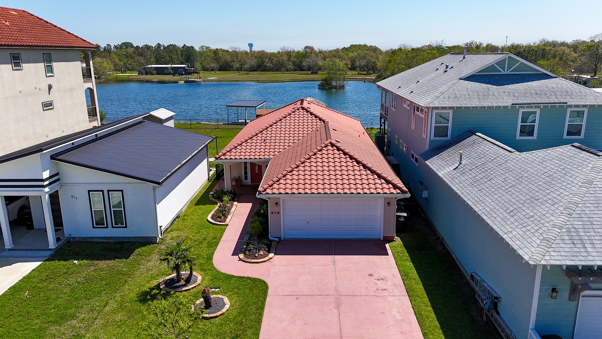 615 28th Street Dickinson, TX 77539 - Photo 2 of 34 an aerial view of a house with swimming pool and mountain view