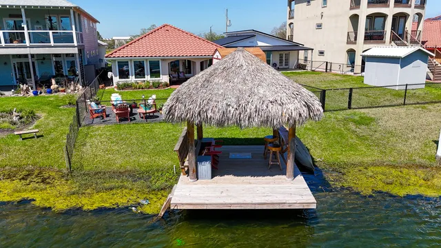 a wooden bench sitting in front of a house