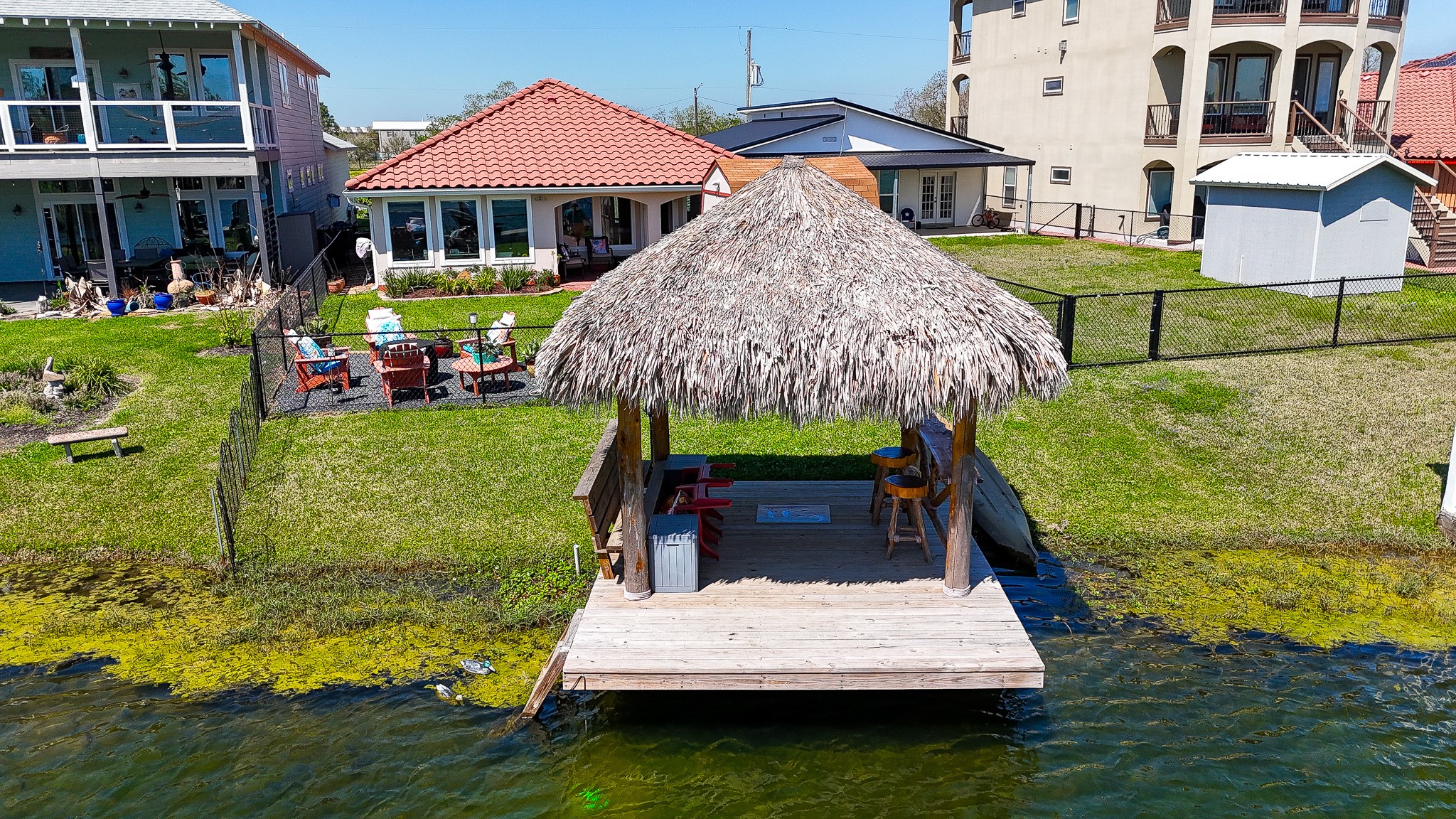 615 28th Street Dickinson, TX 77539 - Photo 3 of 34 a wooden bench sitting in front of a house