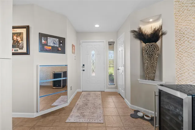 a view of hallway with livingroom and stairs