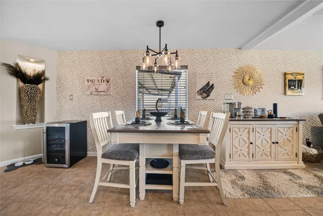a dining room with furniture and window