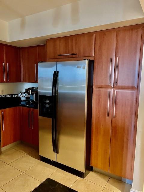 3232 Southwest 22nd Terrace, Unit 1303 Miami, FL 33145 - Photo 10 of 43 a kitchen with a refrigerator and a counter