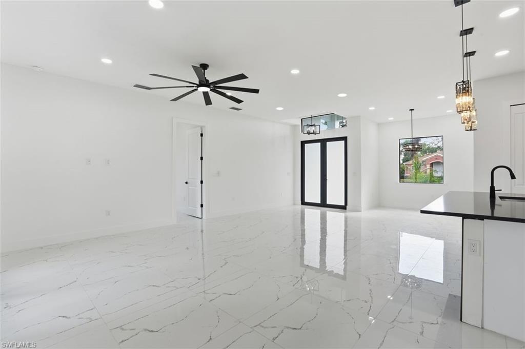 2930 20th Street Southwest Lehigh Acres, FL 33976 - Photo 15 of 43 a view of an empty room with window and a ceiling fan