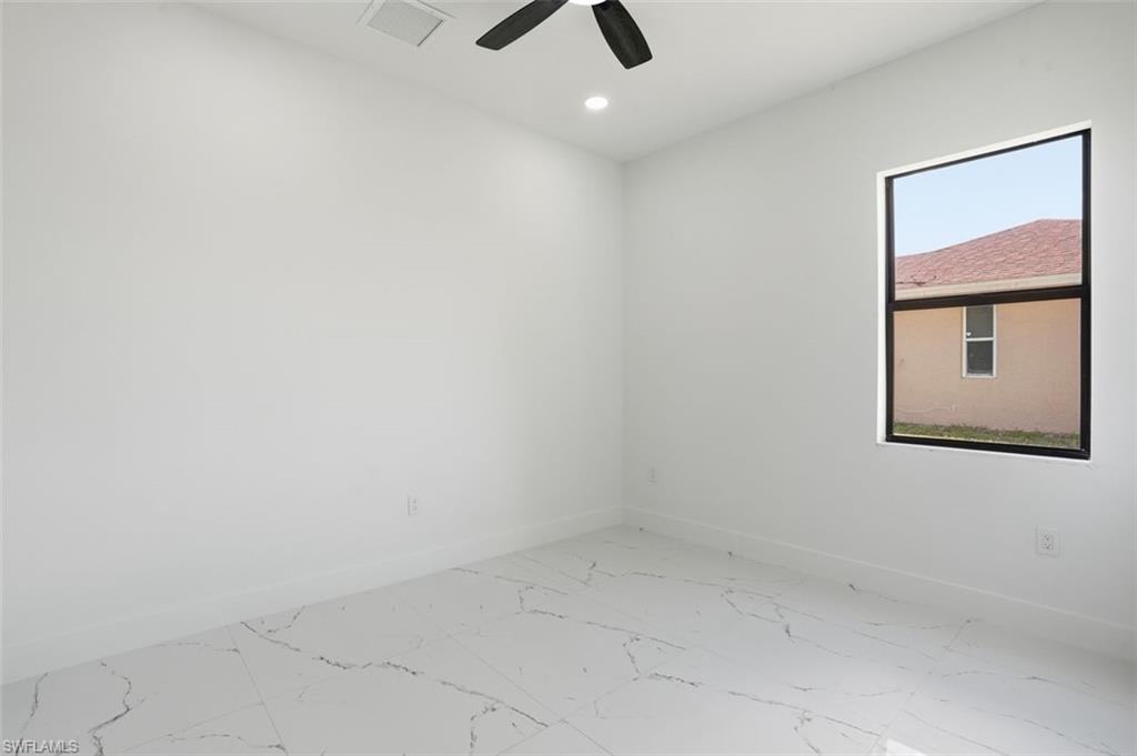 2930 20th Street Southwest Lehigh Acres, FL 33976 - Photo 24 of 43 an empty room with a window