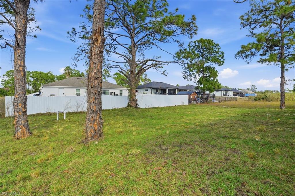 2930 20th Street Southwest Lehigh Acres, FL 33976 - Photo 41 of 43 a view of a house with a yard