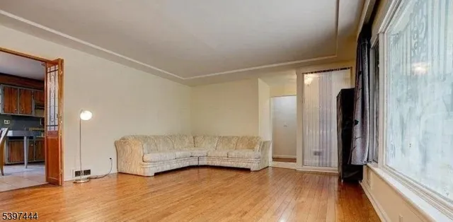 a view of an empty room and glass door