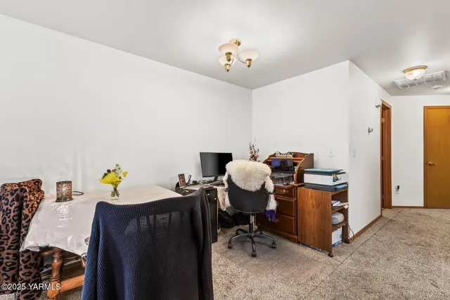 a view of workspace with wooden wall
