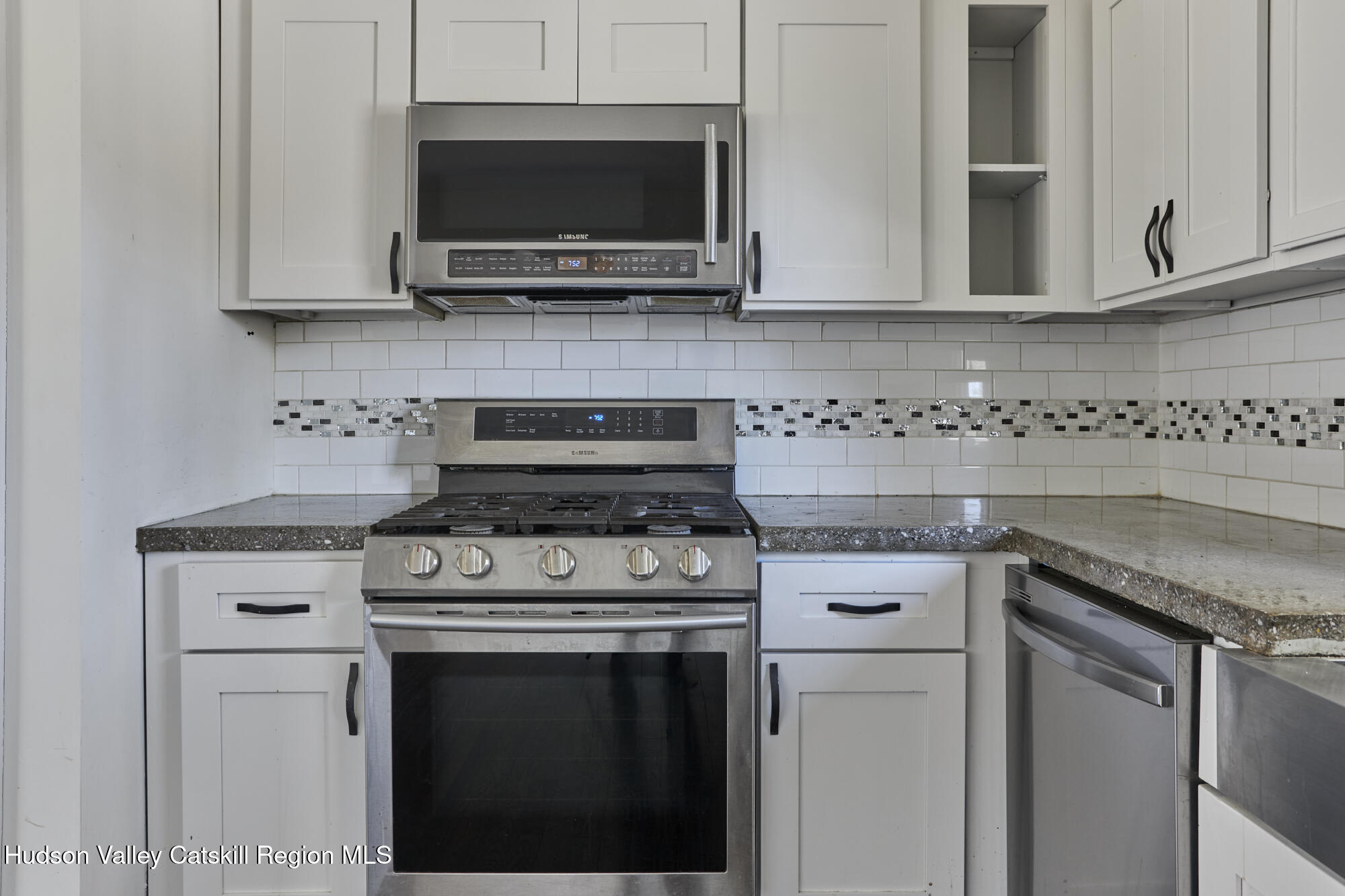 361 Allen Road Salt Point, NY 12578 - Photo 7 of 28 a kitchen with stainless steel appliances granite countertop white cabinets granite counter tops and a wooden floors