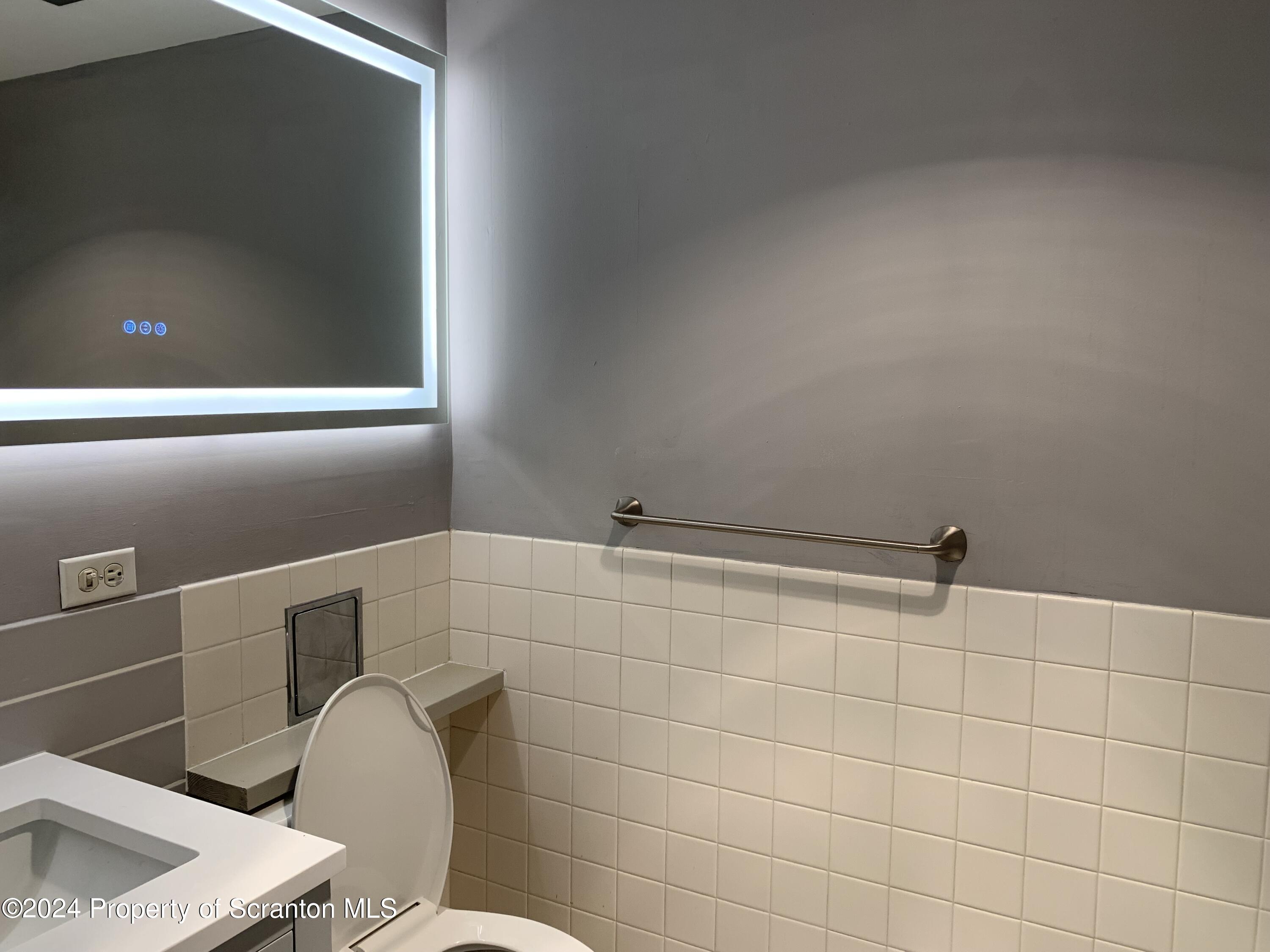 550 Clay Avenue, Unit 9B Scranton, PA 18510 - Photo 12 of 15 a bathroom with a toilet and a sink