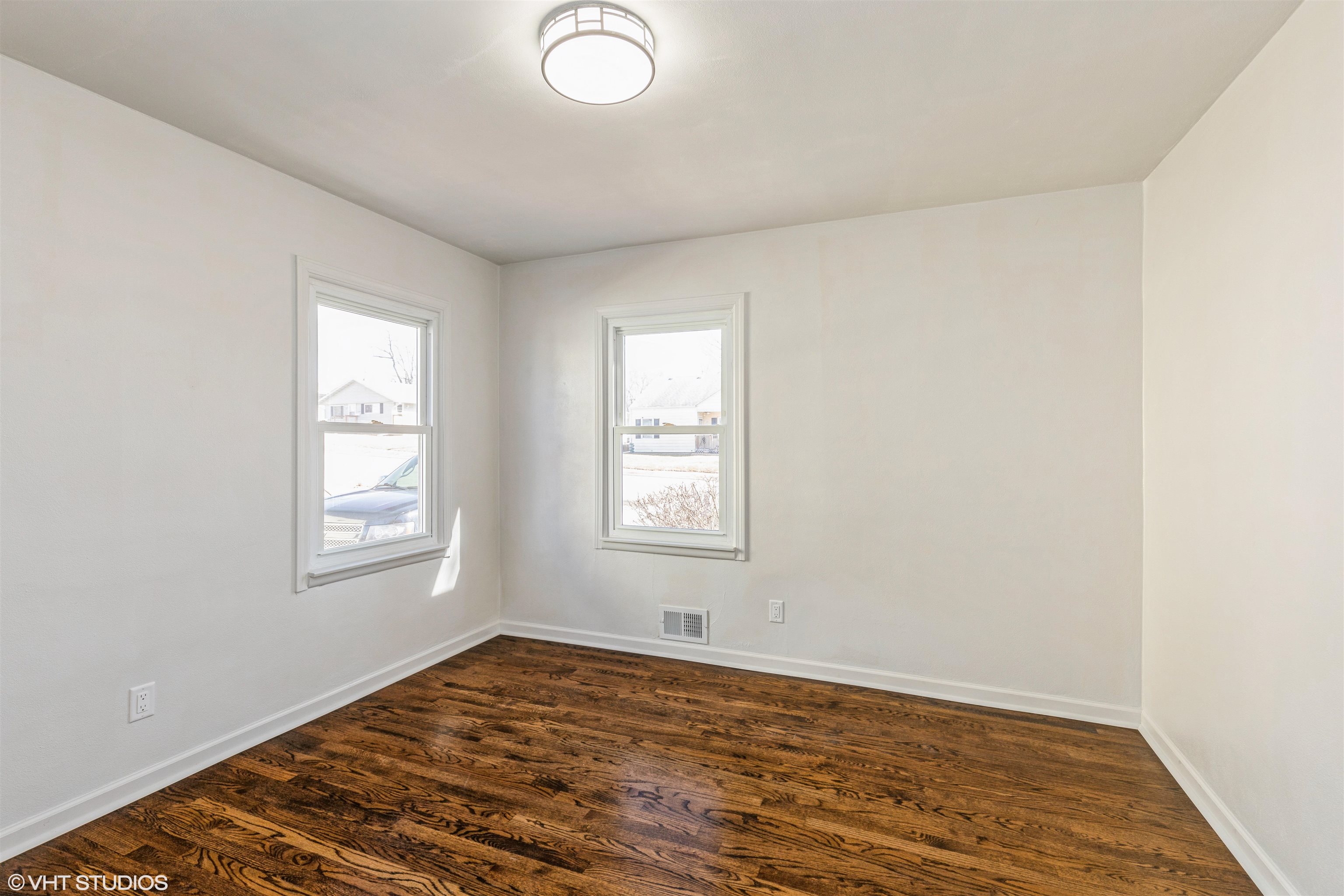 1931 Ridgeland Road Rockford, IL 61108 - Photo 12 of 26 an empty room with wooden floor and windows