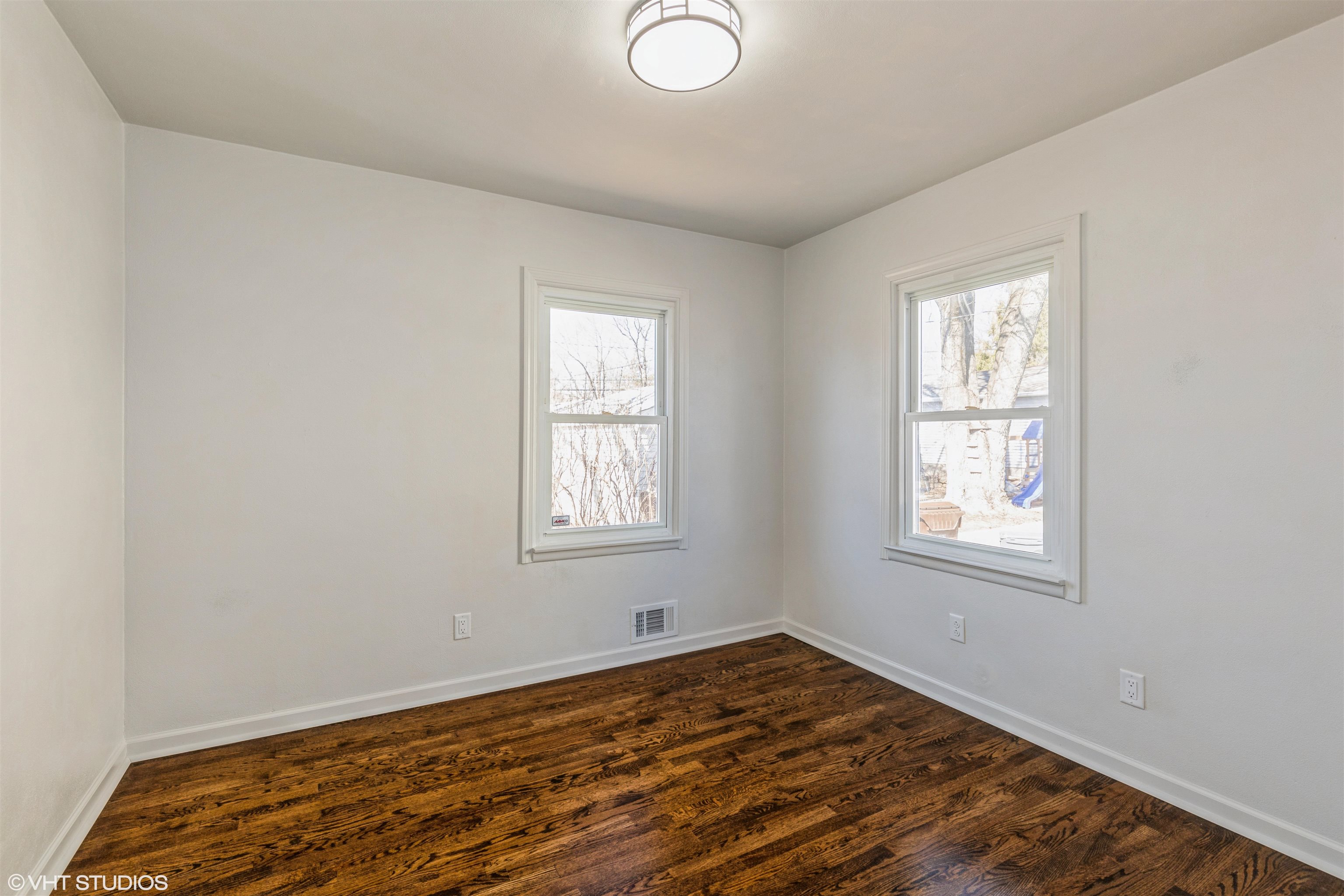 1931 Ridgeland Road Rockford, IL 61108 - Photo 14 of 26 an empty room with wooden floor and windows