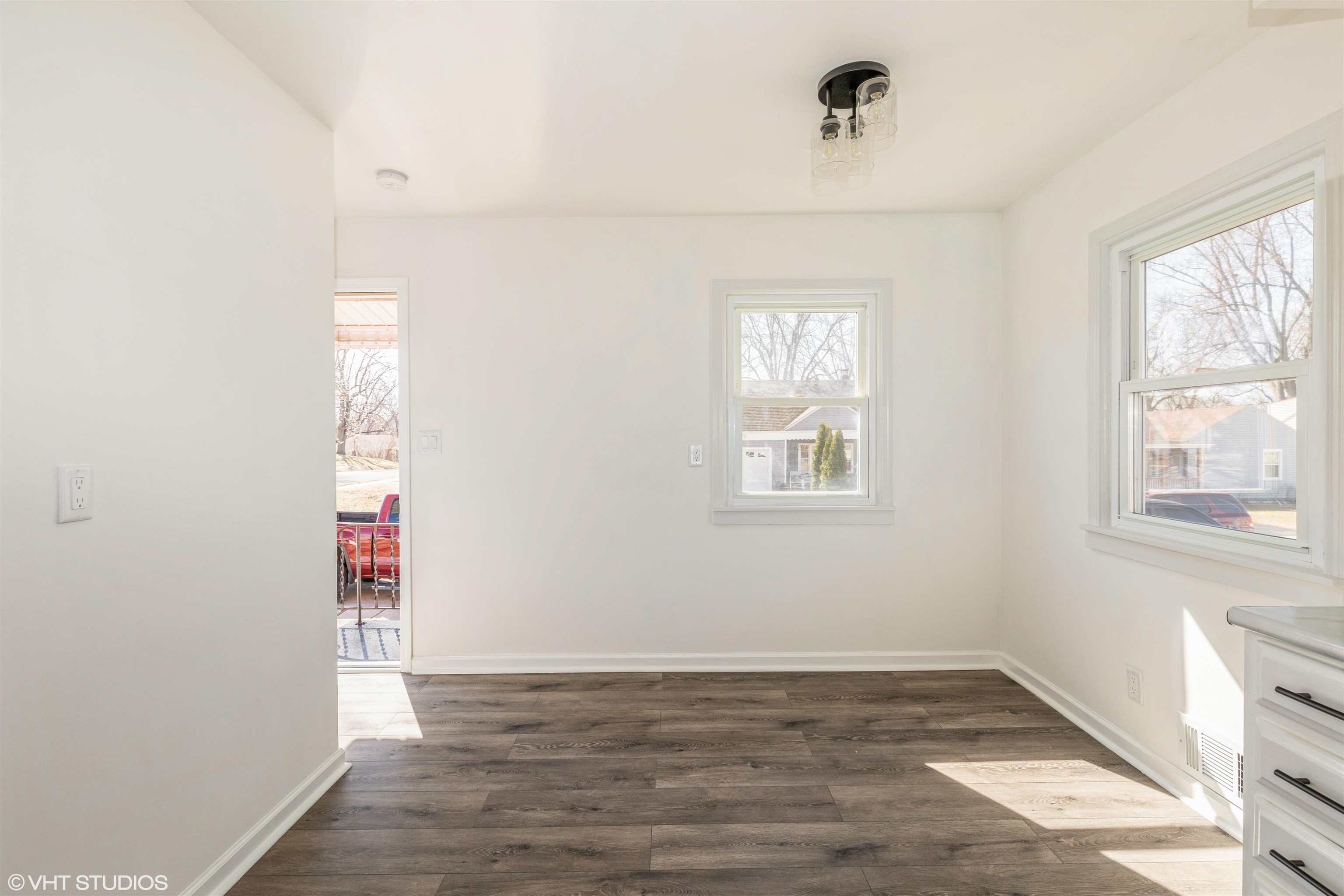 1931 Ridgeland Road Rockford, IL 61108 - Photo 6 of 26 an empty room with wooden floor and windows