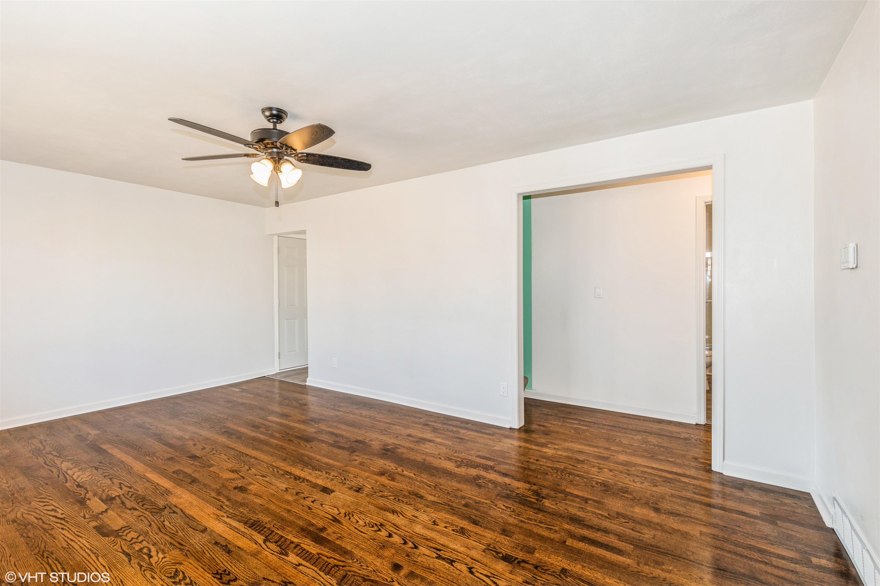 1931 Ridgeland Road Rockford, IL 61108 - Photo 9 of 26 a view of room with wooden floor and ceiling fan