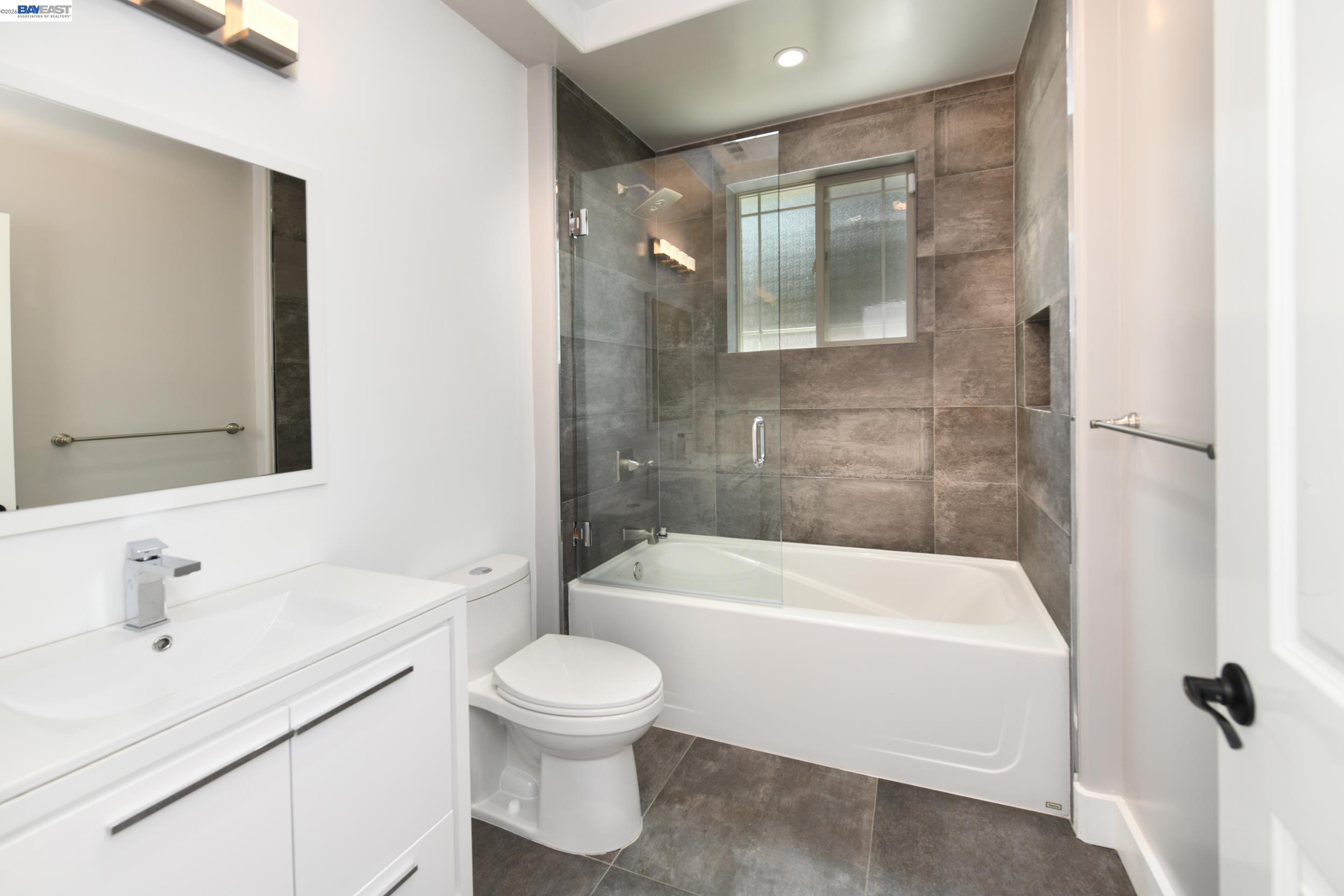 1516 Pleasant Hill Road Lafayette, CA 94549 - Photo 29 of 38 a bathroom with a bathtub shower sink vanity and toilet