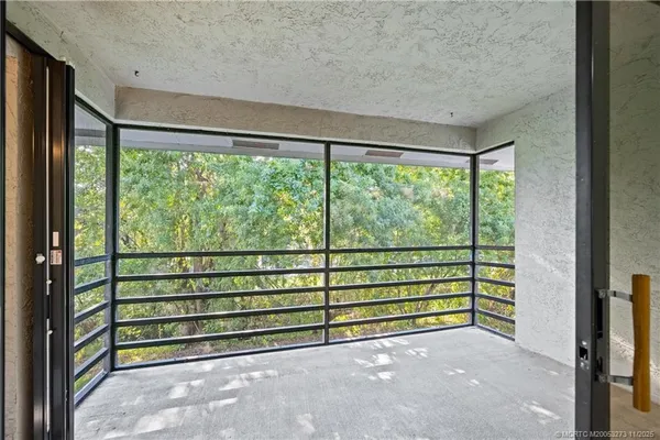 a view of a room with a large window