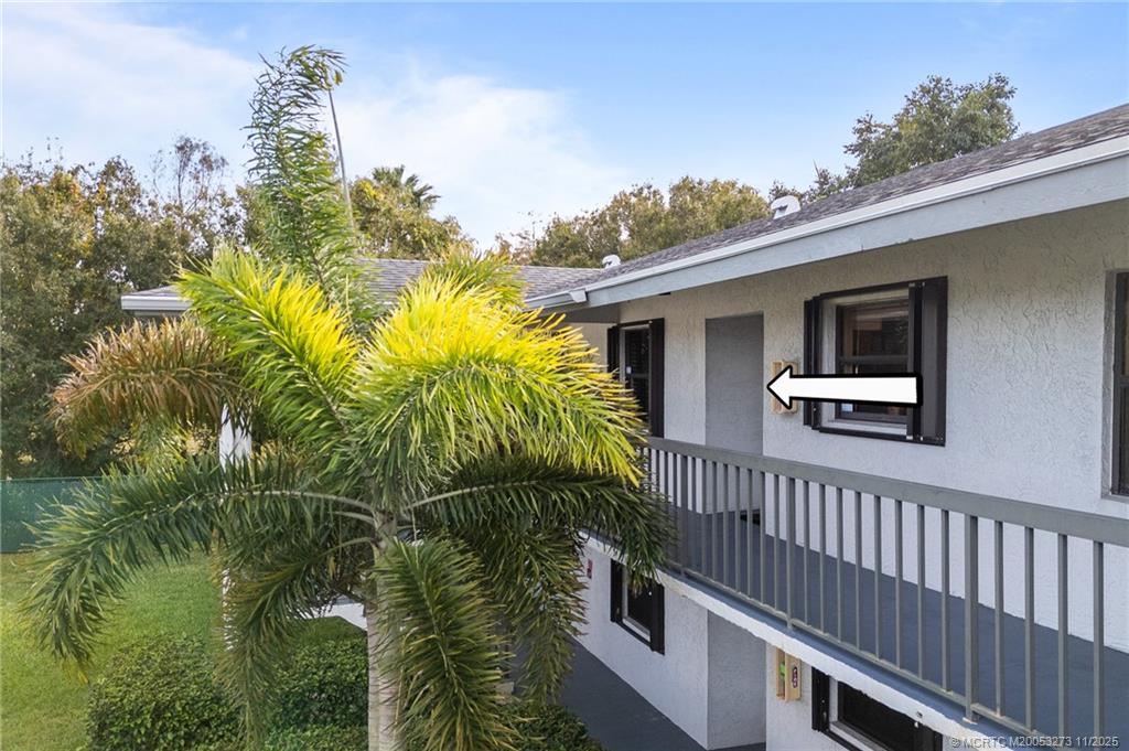 1210 Southeast Parkview Place, Unit 9 Stuart, FL 34994 - Photo 22 of 36 a view of a house with a yard