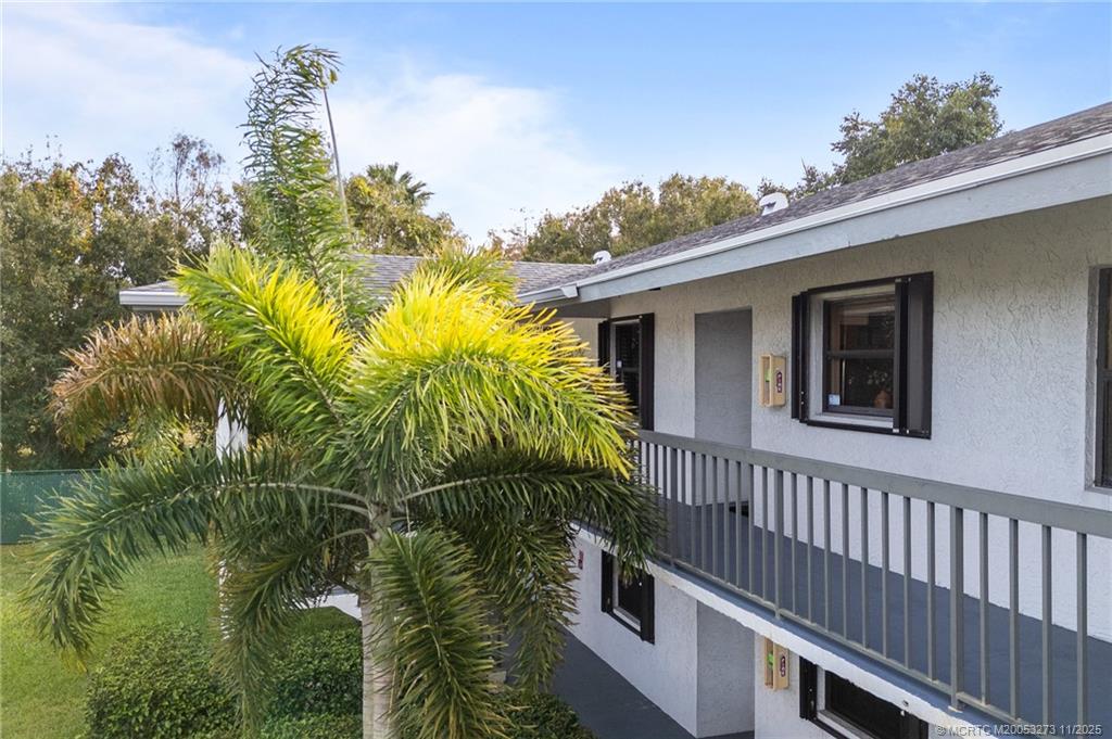 1210 Southeast Parkview Place, Unit 9 Stuart, FL 34994 - Photo 23 of 36 a view of a house with a yard