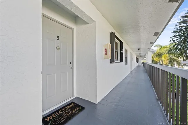 a view of hallway with wooden floor