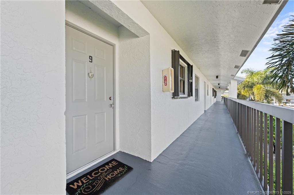 1210 Southeast Parkview Place, Unit 9 Stuart, FL 34994 - Photo 4 of 36 a view of hallway with wooden floor
