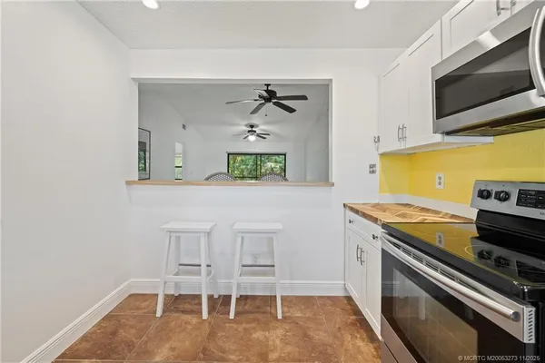 a kitchen with a stove and a microwave