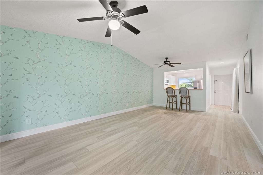 1210 Southeast Parkview Place, Unit 9 Stuart, FL 34994 - Photo 9 of 36 wooden floor in an empty room