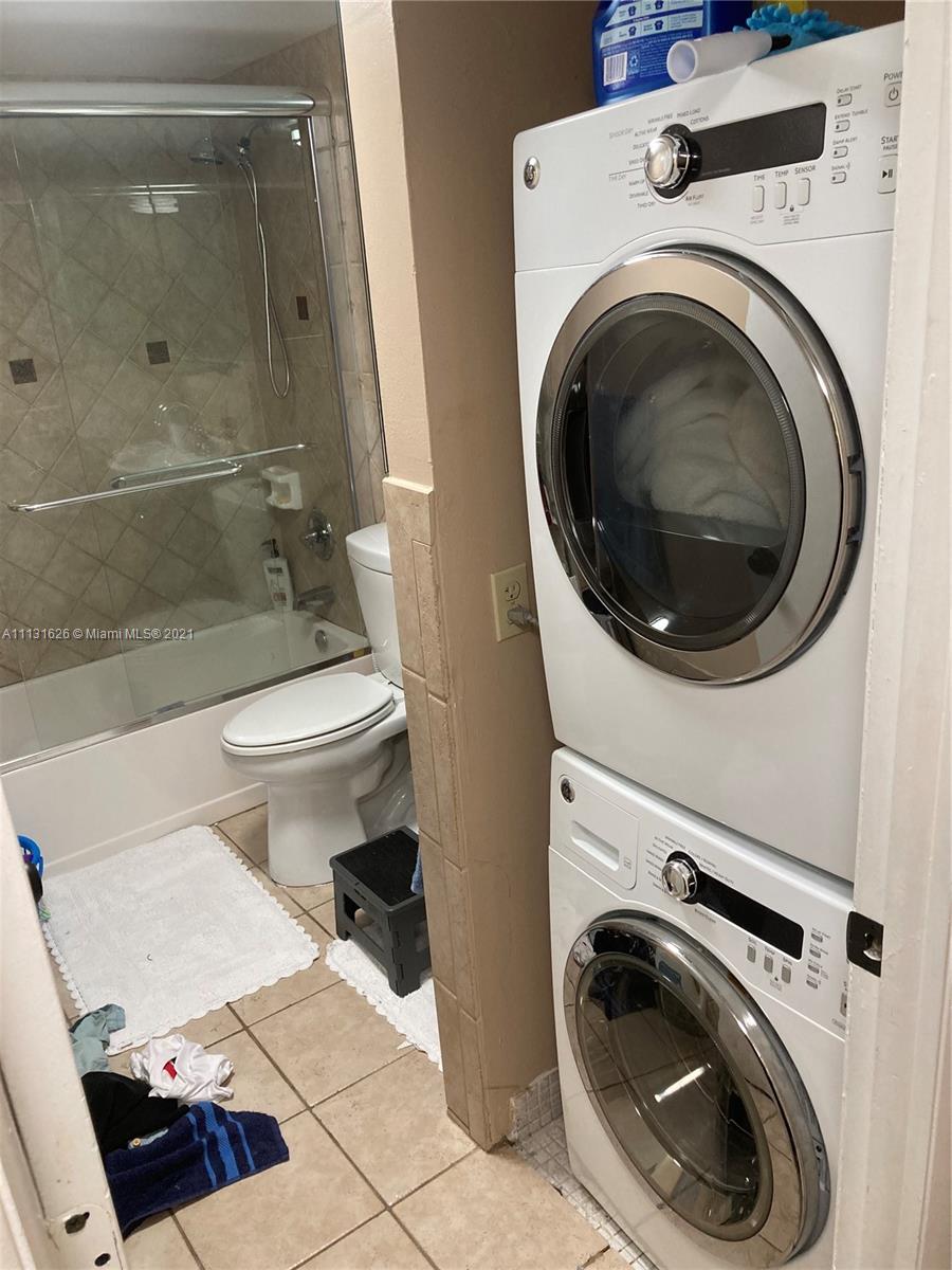 4172 Inverrary Drive, Unit 112 Lauderhill, FL 33319 - Photo 11 of 18 a utility room with dryer and washer