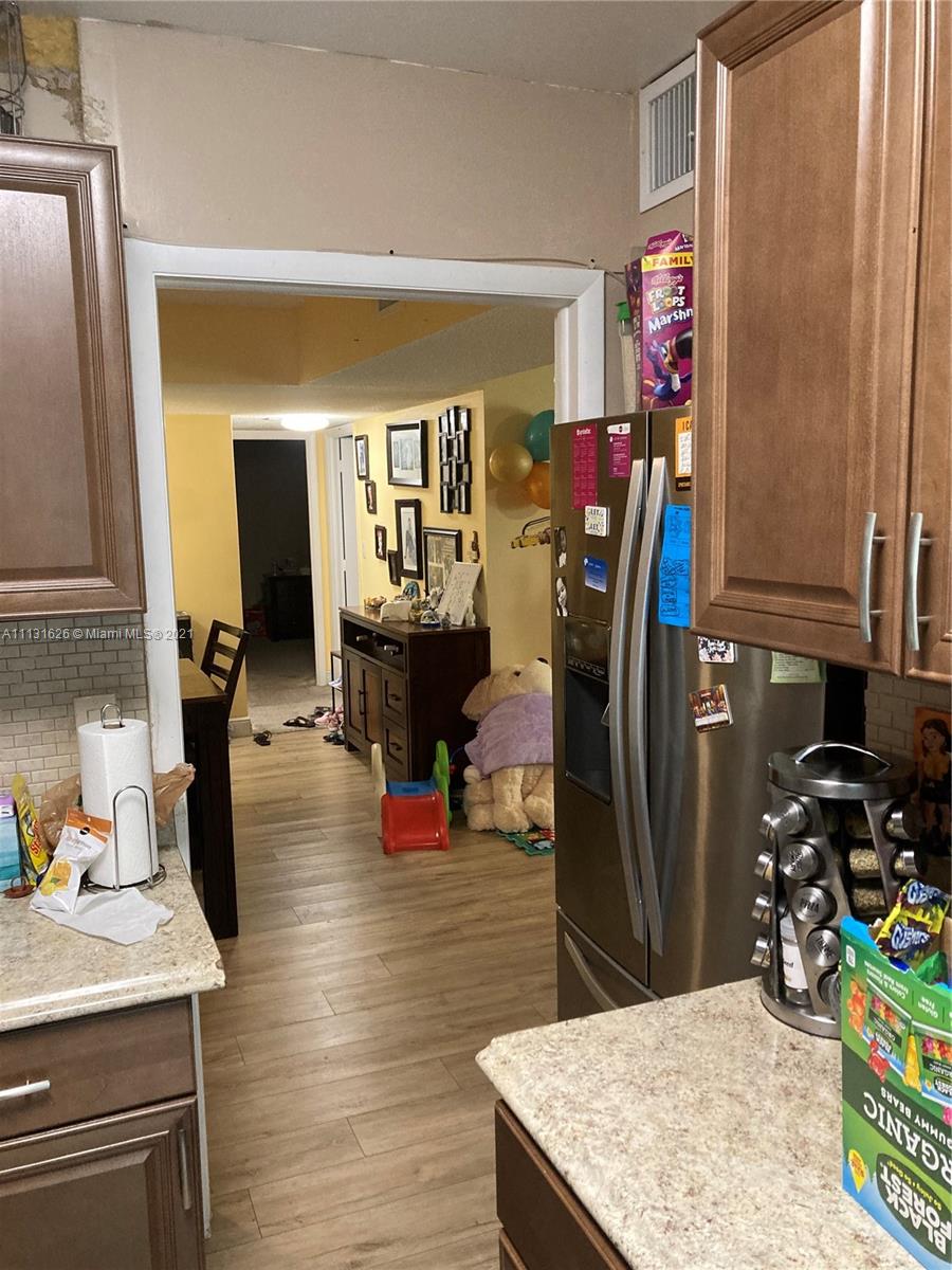 4172 Inverrary Drive, Unit 112 Lauderhill, FL 33319 - Photo 15 of 18 a view of a kitchen with furniture and a kitchen