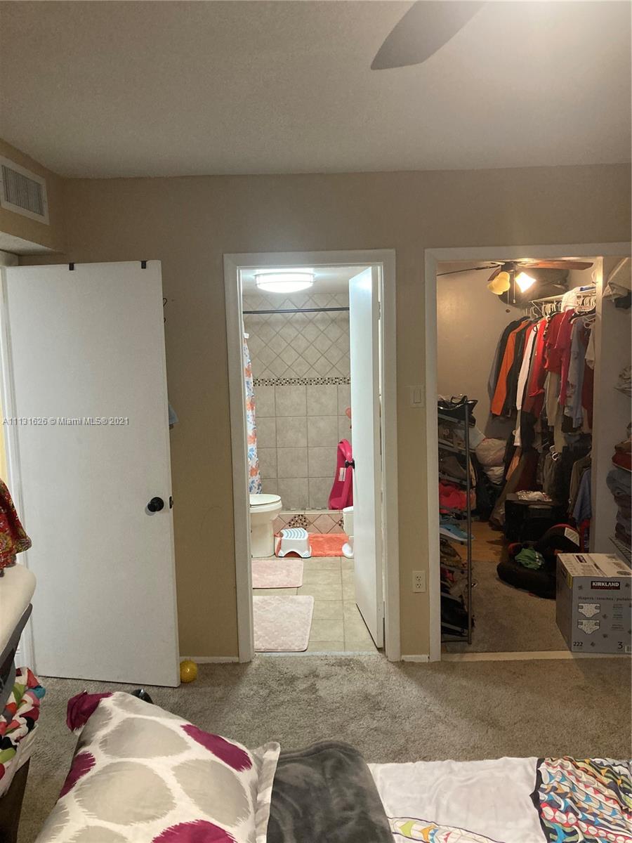 4172 Inverrary Drive, Unit 112 Lauderhill, FL 33319 - Photo 7 of 18 a living room with furniture and gym equipment