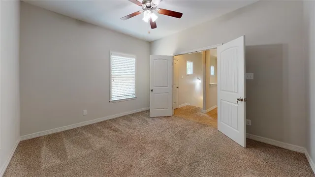 a bathroom with a toilet and a bath tub