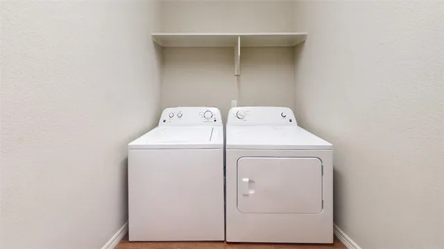 an empty room with ceiling fan and window