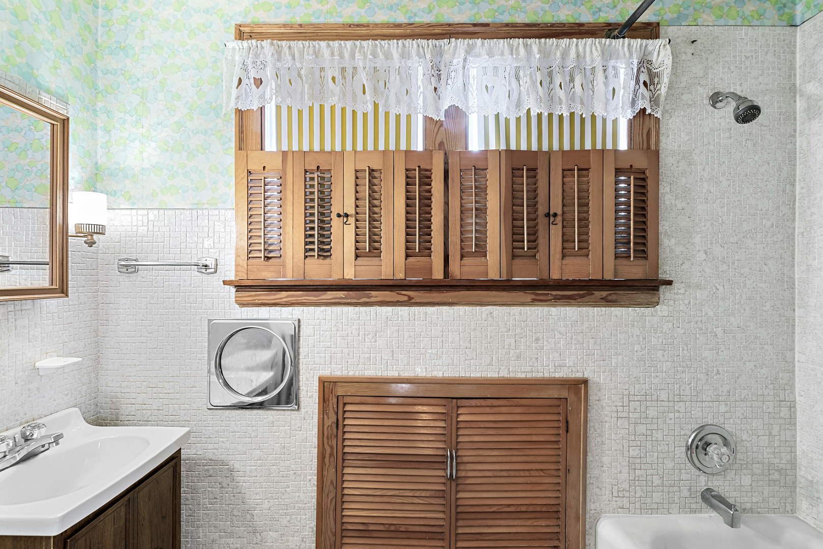 2425 North Mango Avenue Chicago, IL 60639 - Photo 15 of 17 a bathroom with a sink and a window