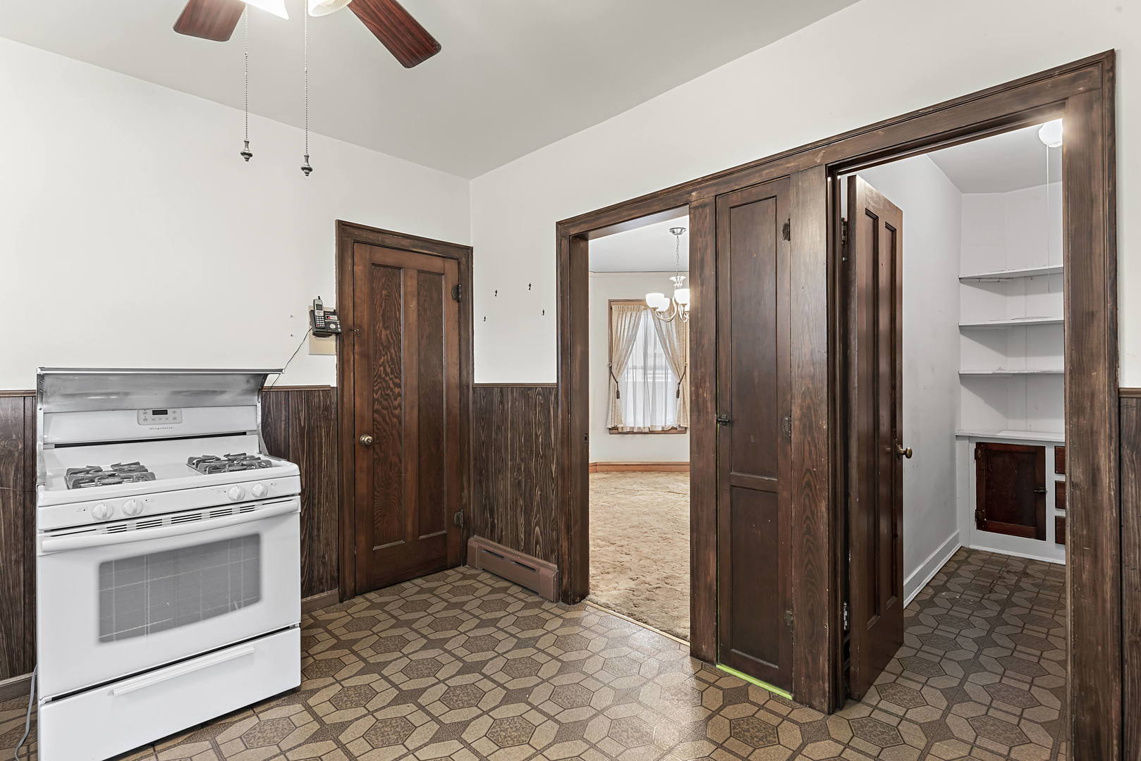2425 North Mango Avenue Chicago, IL 60639 - Photo 7 of 17 a kitchen with a stove and a refrigerator