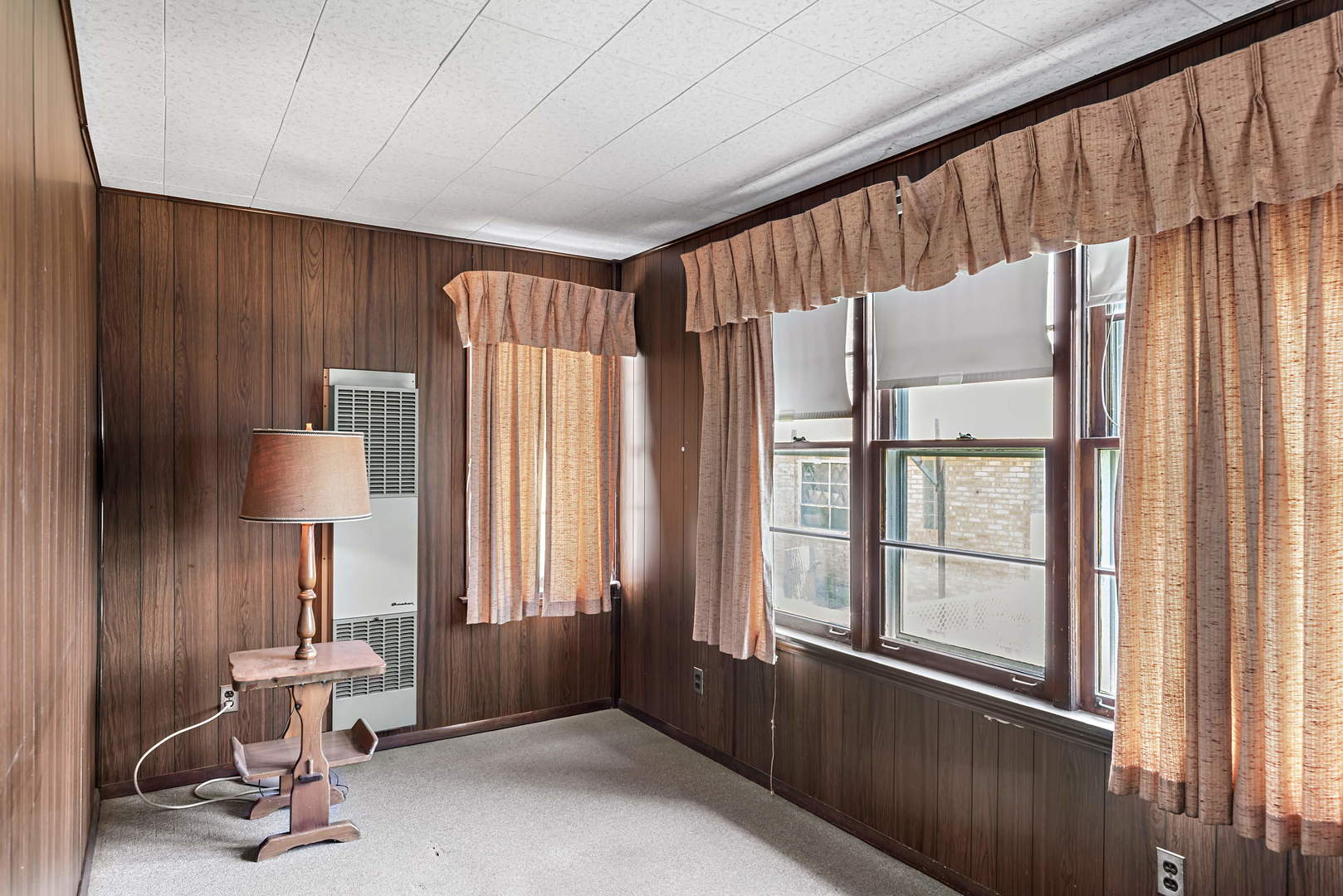 2425 North Mango Avenue Chicago, IL 60639 - Photo 9 of 17 a bathroom with a window and a chair