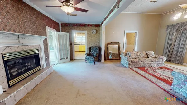 a living room with furniture and a fireplace