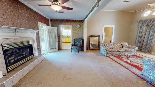 a living room with furniture and a fireplace
